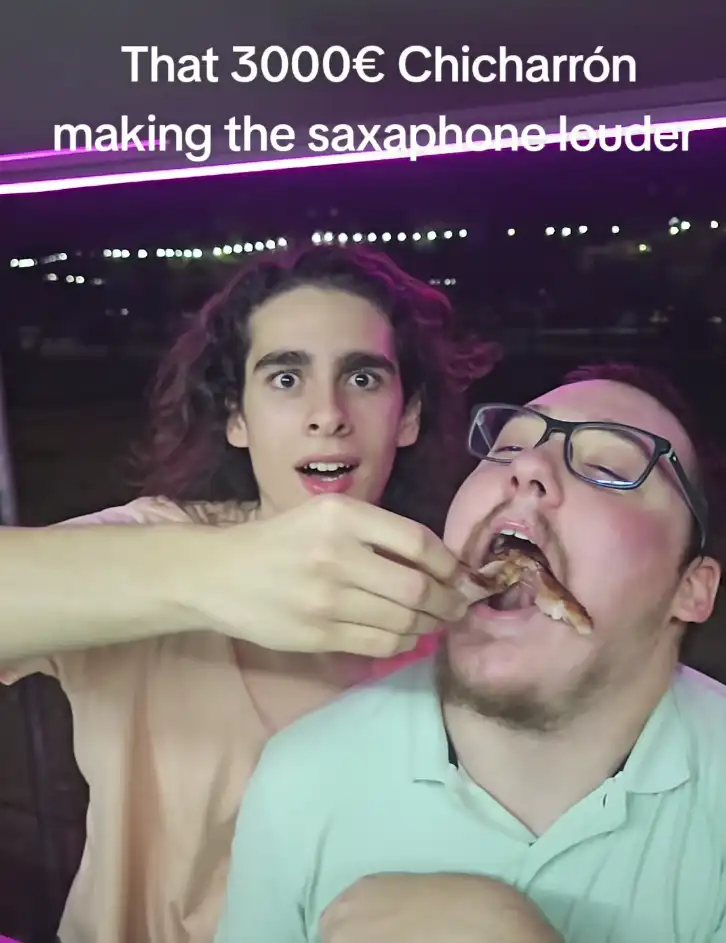 Joe sharing food with a friend at a restaurant
